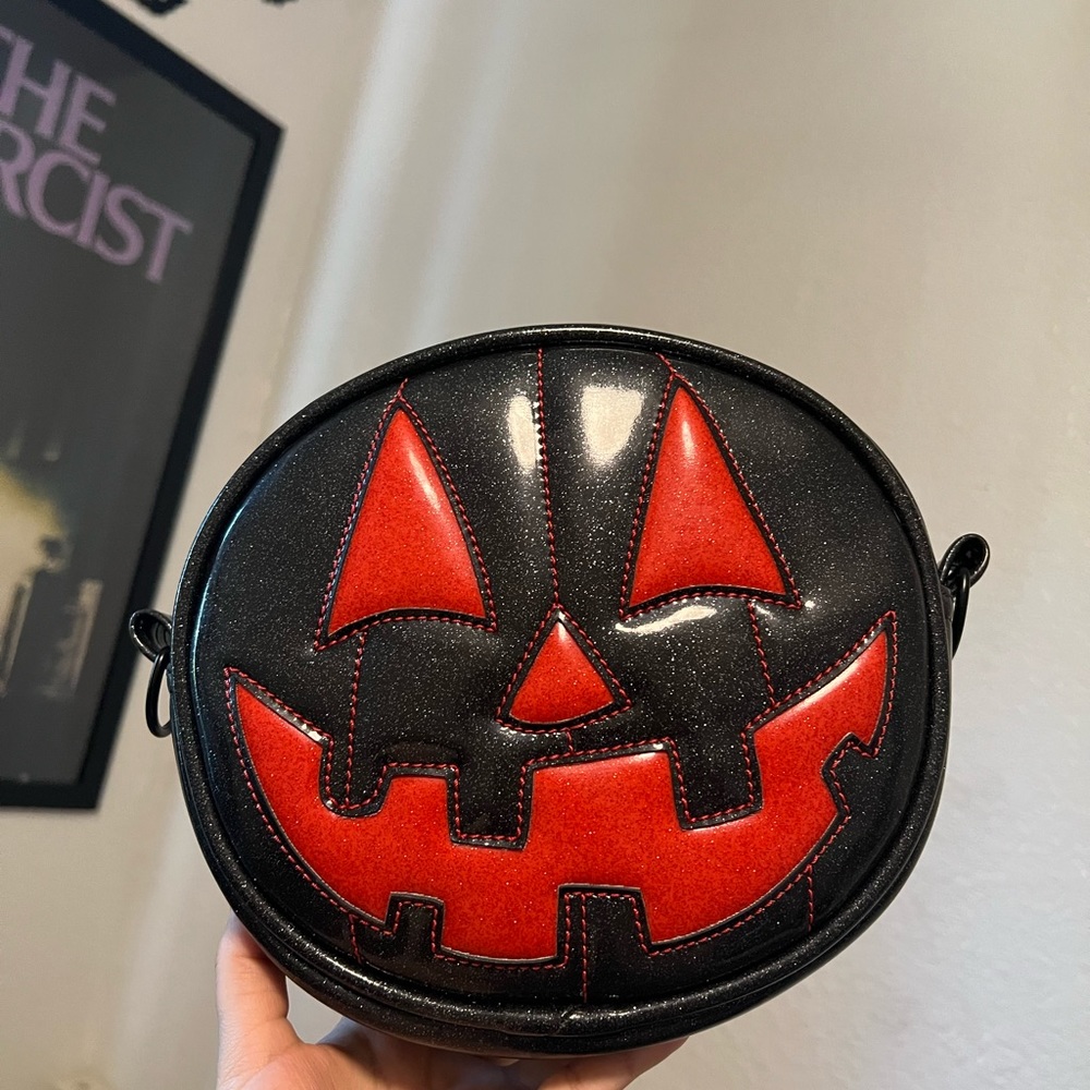 New never carried small black and red smiley bag from Love Pain and Stitches